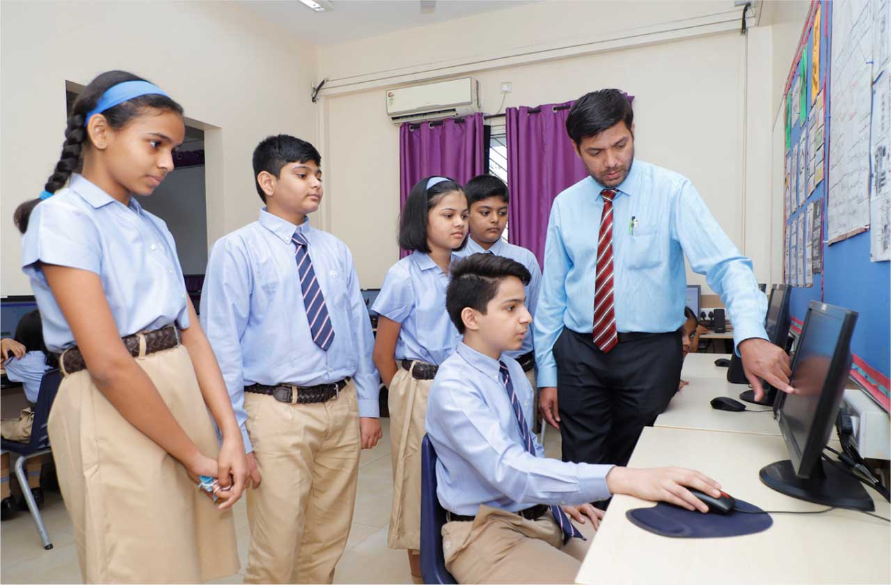 A school student using a laptop in a classroom with a teacher guiding them on safe internet use, featuring visual elements like a shield, lock, privacy, and cybersecurity icons.