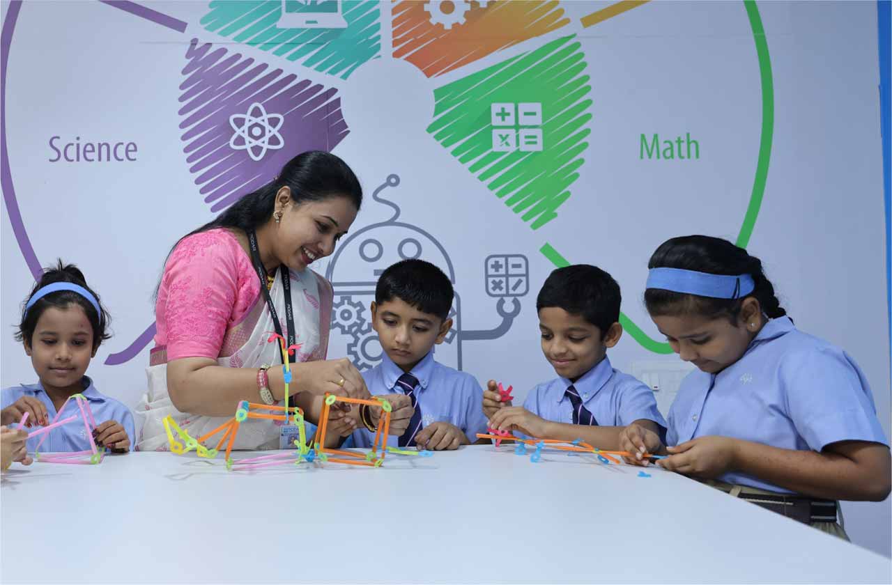 A group of CBSE school students working on a hands-on engineering/STEM project in a modern school lab.