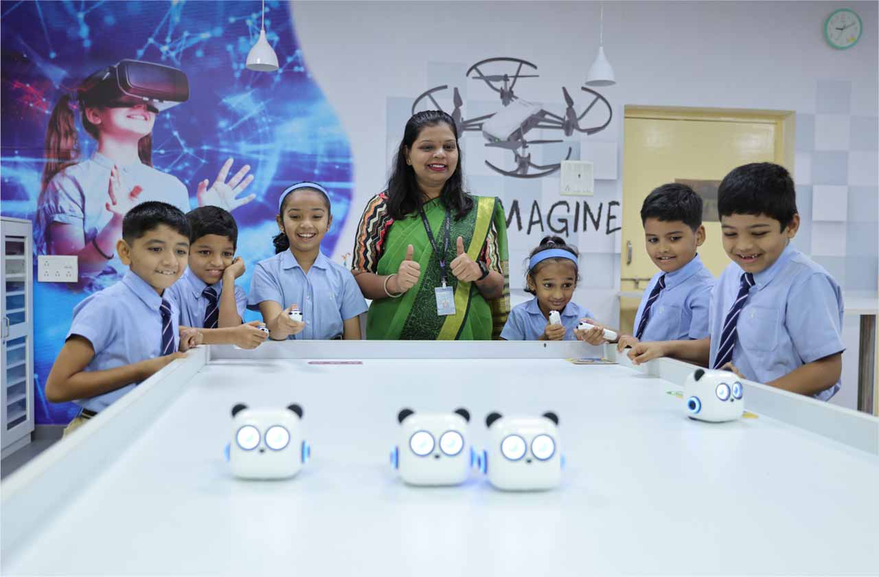 Students conducting a hands-on classroom experiment together with a teacher, showing practical learning, curiosity, teamwork, and real-world application of concepts.