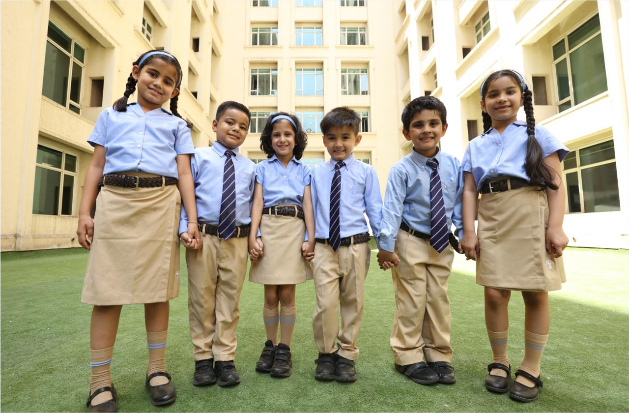 Bright, clean campus building with children walking in
