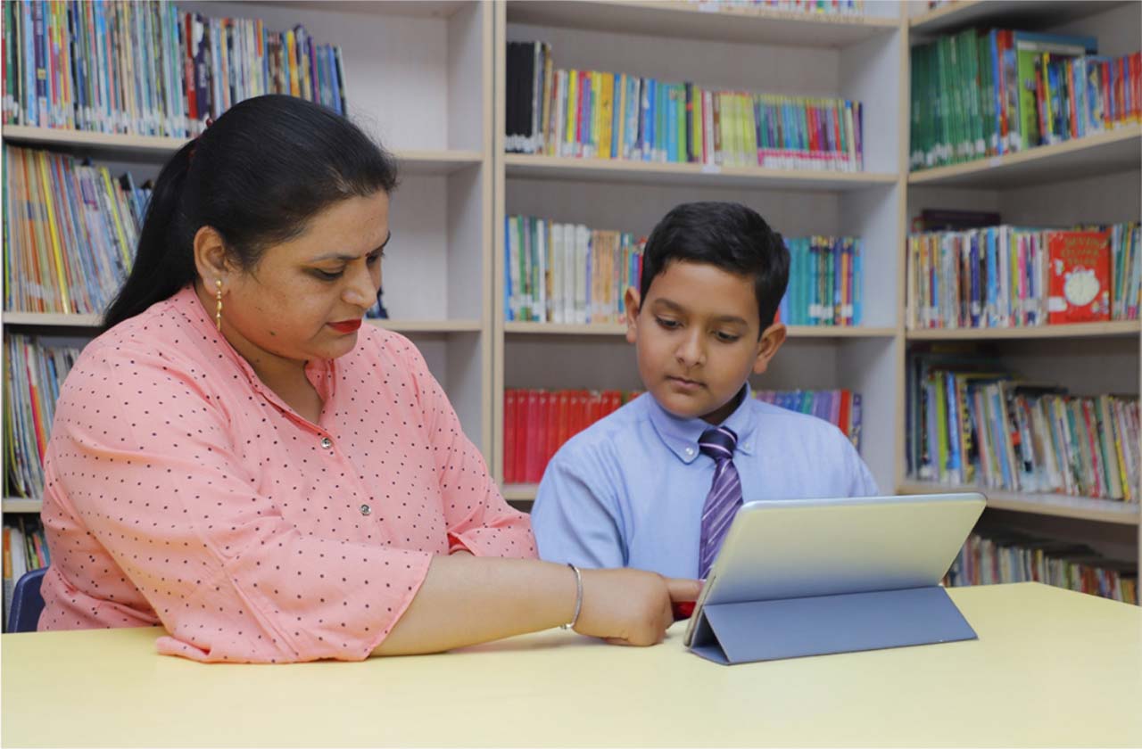 Teacher educating students about digital safety in classroom