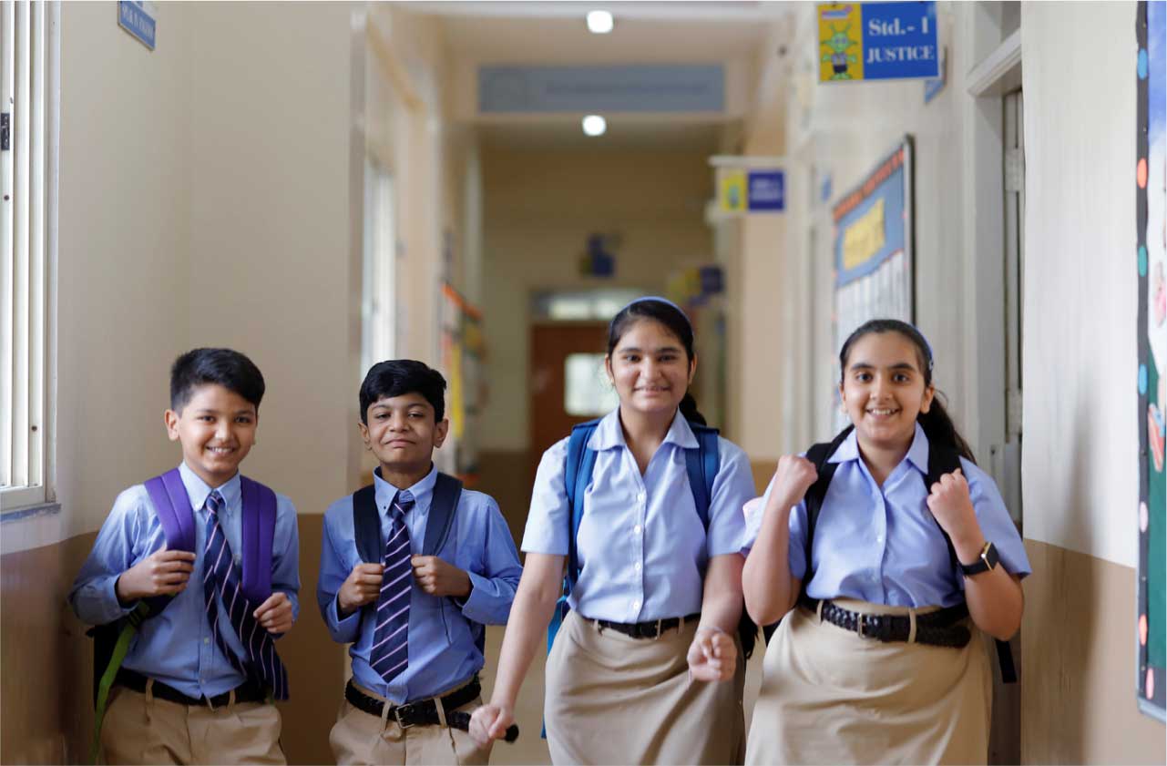 Parents and child interacting with school staff or touring classrooms.