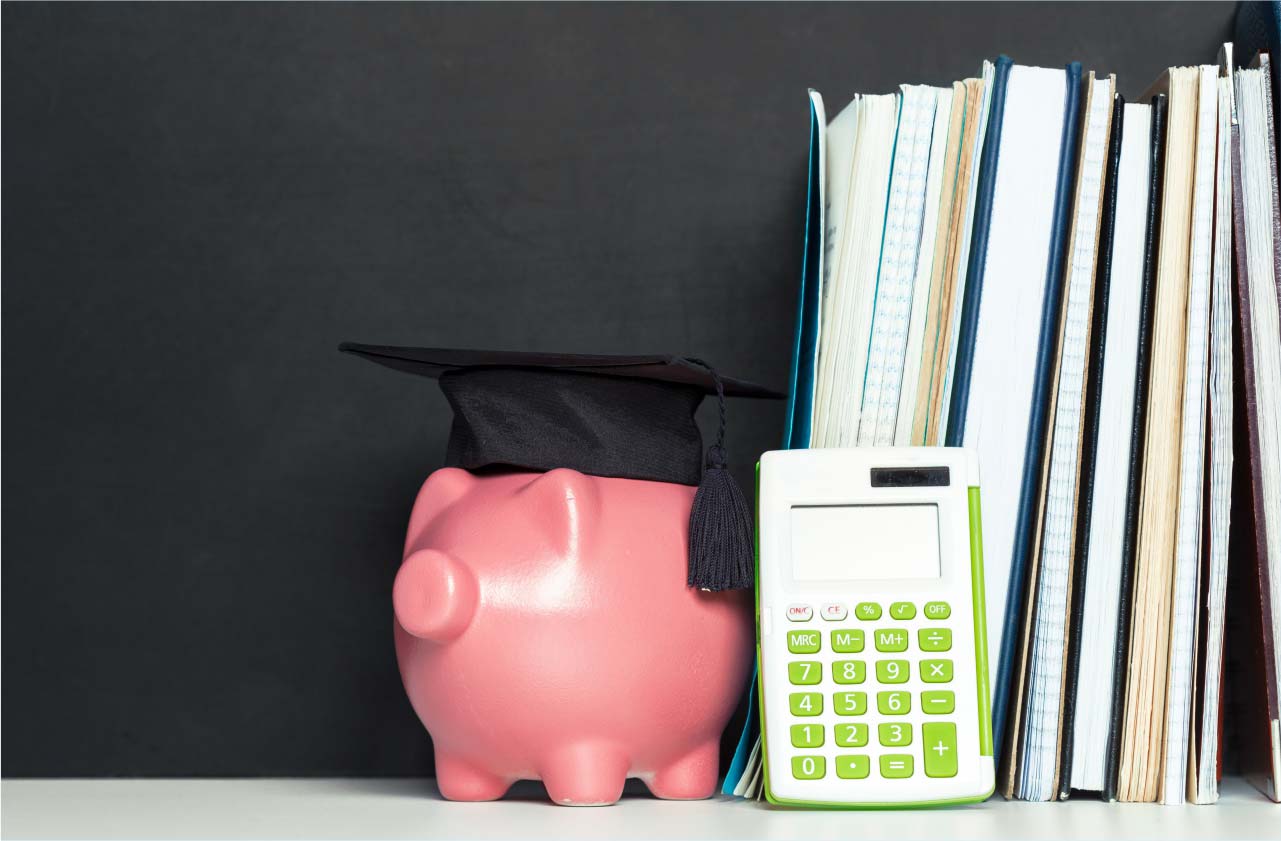 A piggy bank next to a calculator