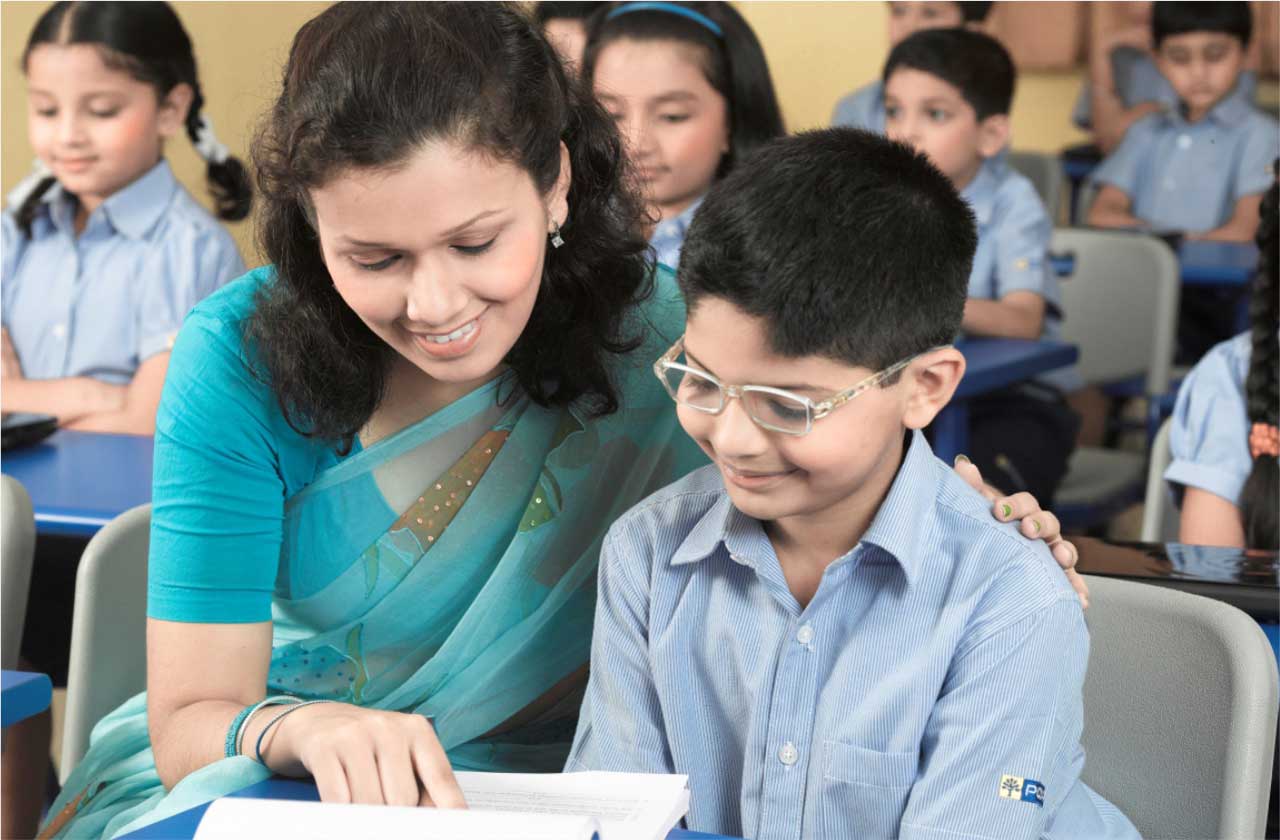 A teacher motivating students in a supportive, low-stress learning environment that promotes confidence and success.