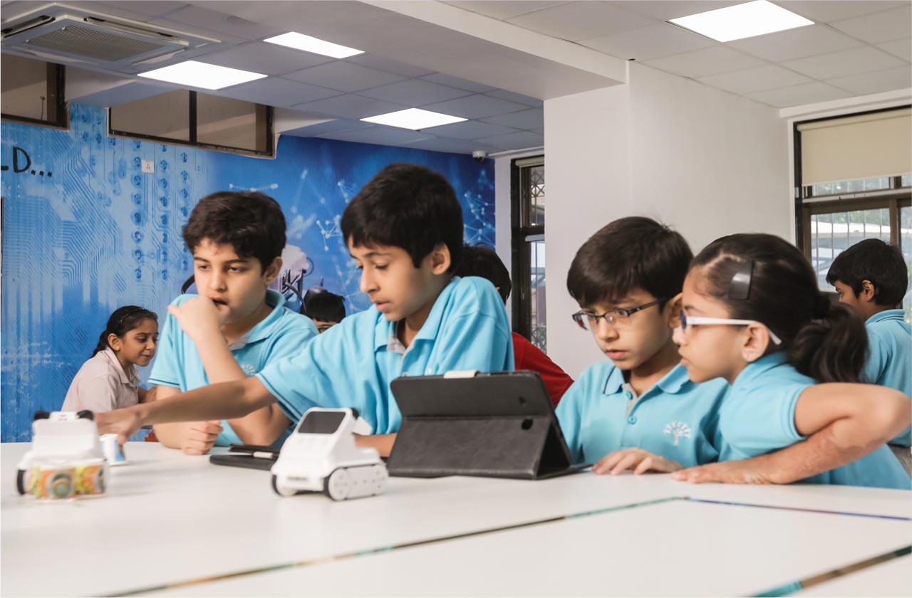 Students actively learning through a hands-on classroom activity, such as experiments, group projects, or creative tasks, showing curiosity and teamwork.